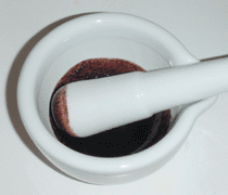 Ground ferric acetate in oil