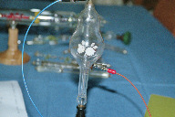 Tube with a flower shaped fluorescent target in soft ambient light (click to enlarge)