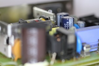 The two blue electrolytic capacitors in this picture are the low voltage filter capacitors. These ones are in good shape.